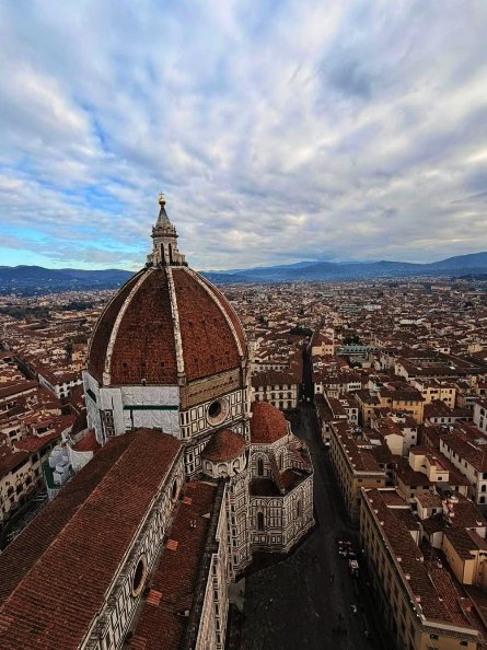 The dome of Florence Cathedral above the terracotta rooftops