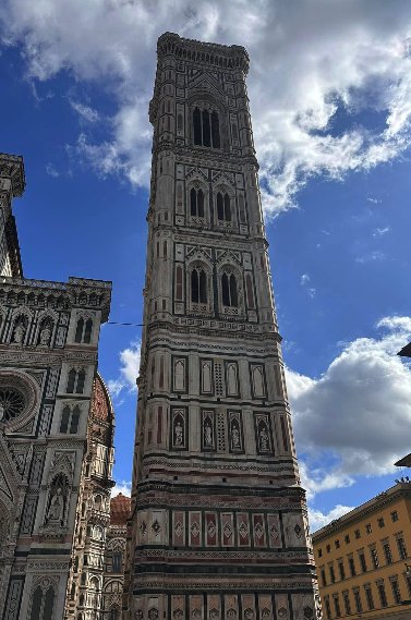 Giotto's Bell Tower rising against a blue sky