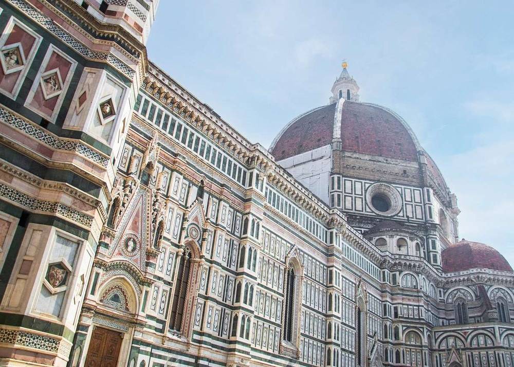 The tricolour marble facade of the cathedral