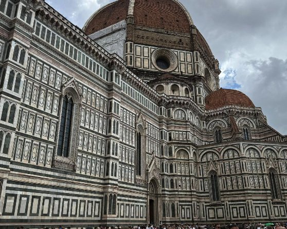 The marble flank and dome of the Florence Duomo from Piazza del Duomo