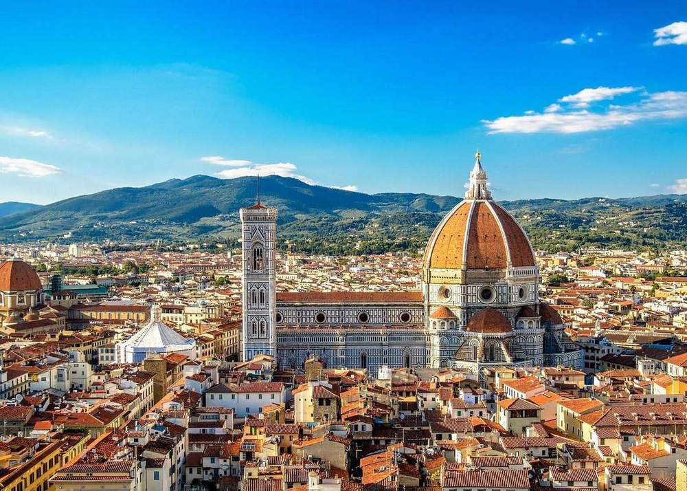 The Florence Duomo and bell tower over the rooftops